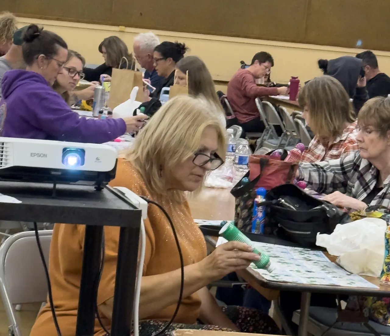 Wine Country Bingo players marking cards together at the Santa Rosa Veterans Memorial Building.
