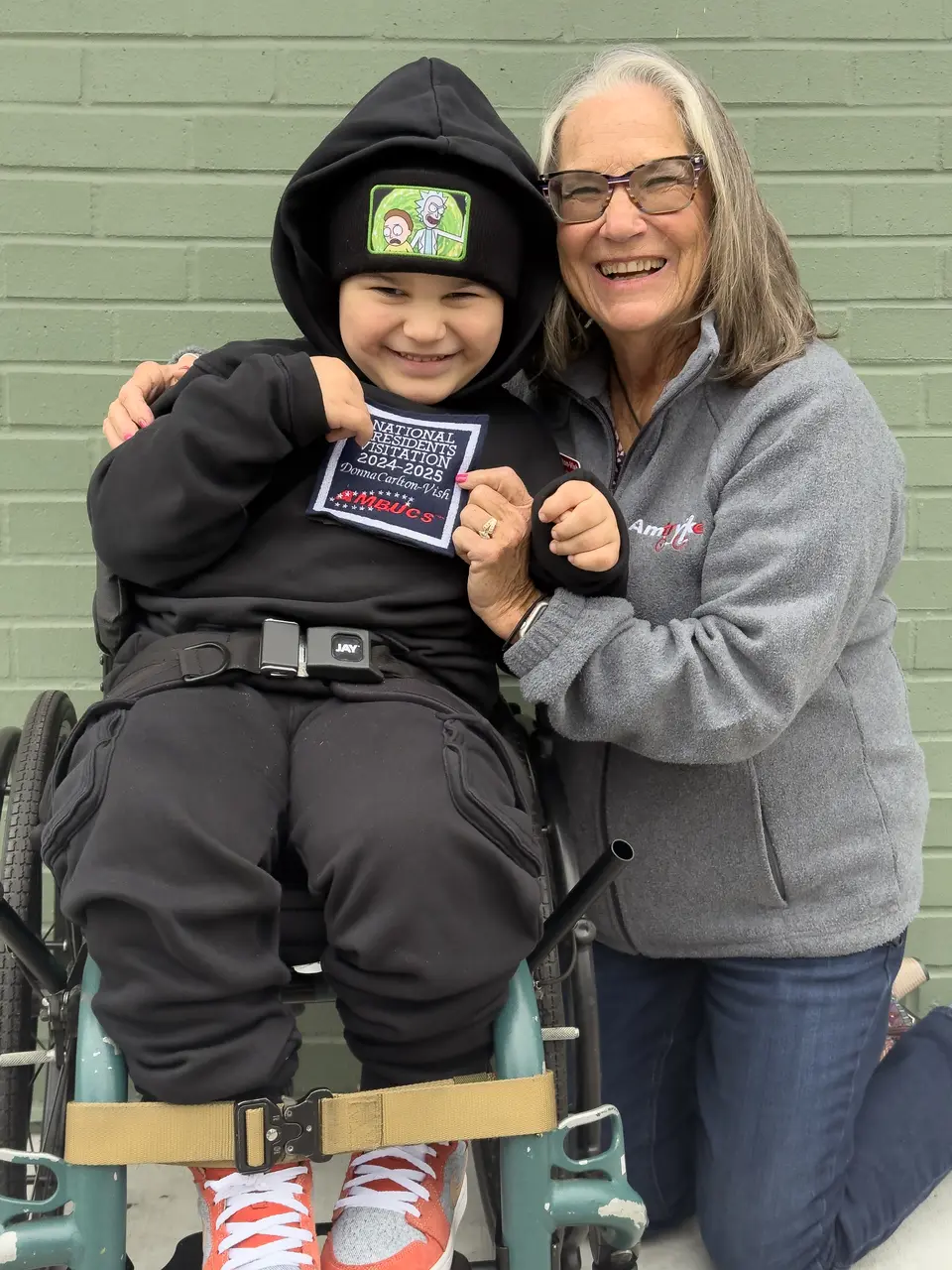 Lukas seated beside Donna during a Wine Country Trykes community moment.